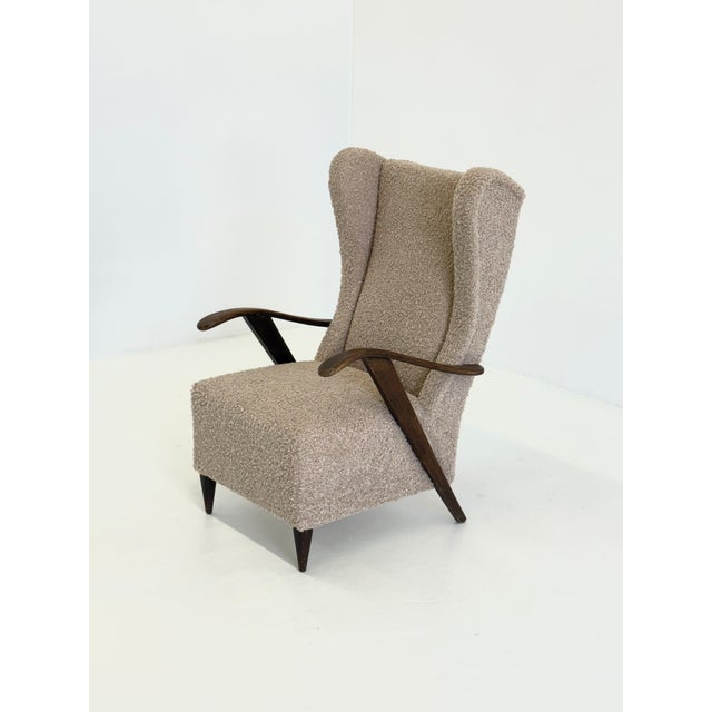 This iconic armchair by Melchiorre Bega is a beautiful example of refined Italian design. The elegant, high backrest,...