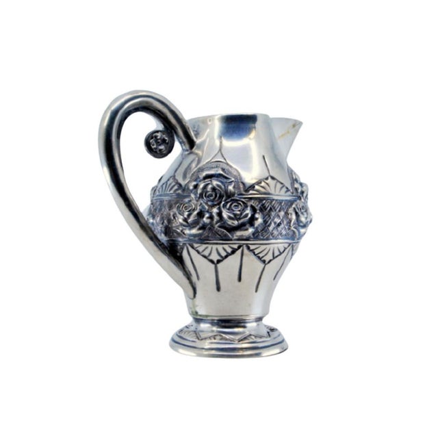 Wine Jug in Embossed Silver with Floral Motifs and Resting on Frilled Base For Sale - Image 11 of 11