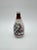 An elegant antique Japanese porcelain sake bottle, featuring a refined ink-style landscape painting depicting mountains,...