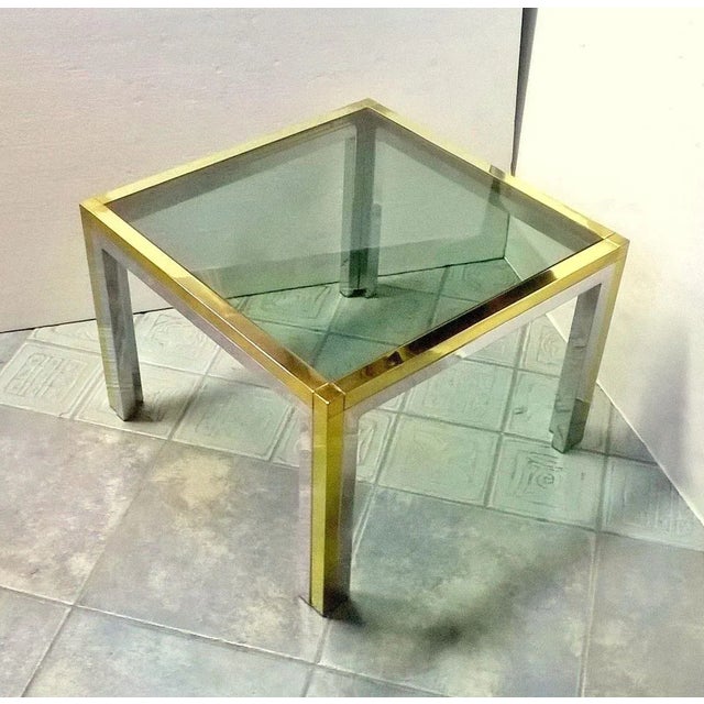 Solid brass low table,1960s. Made in Italy. Green fumè glass. Bicolor brass and chromed. Very good condition. Maker unknown.