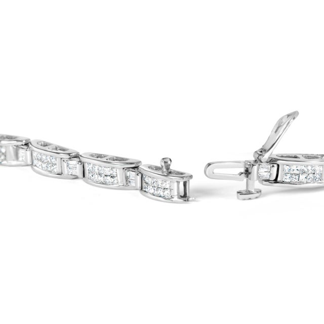 This breathtaking tennis bracelet is a true testament to the beauty of natural diamonds. Crafted from exquisite 14K white...