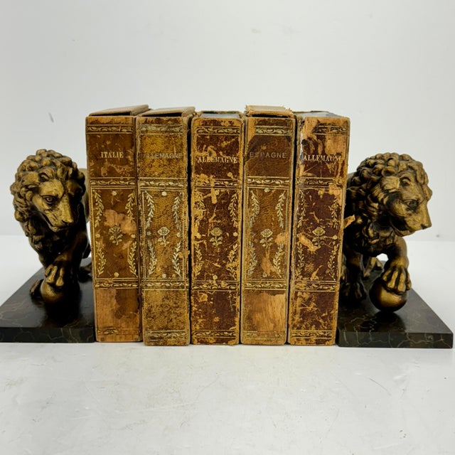 Pair of Mid Century Modern Cast Iron Lion Bookends on Faux Marble Cast Iron Bases