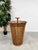 Tropical rain! with this vintage rattan umbrella stand, even your umbrellas will have a place of honor in your home....