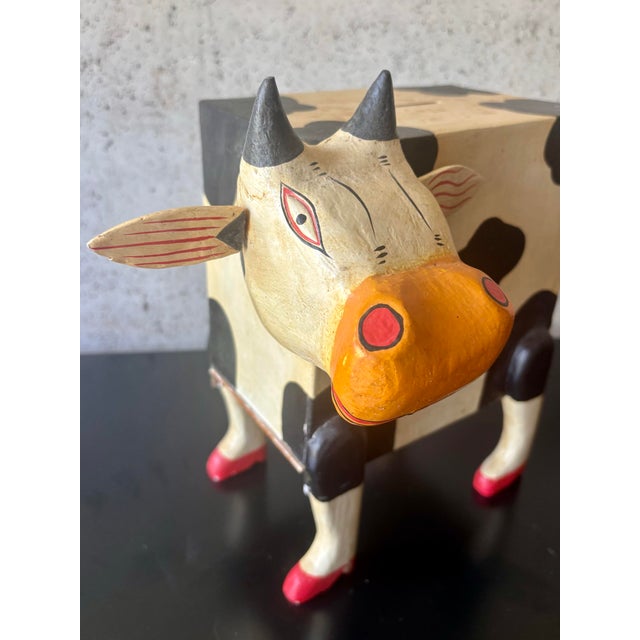 A wonderfully whimsical vintage folk art cow, handmade and hand painted with an expressive personality all its own. The...