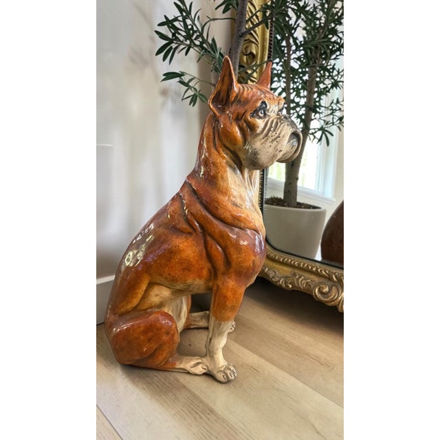 An impressive large-scale vintage Boxer dog sculpture dating to approximately the 1960s–1970s. Beautifully modeled with...