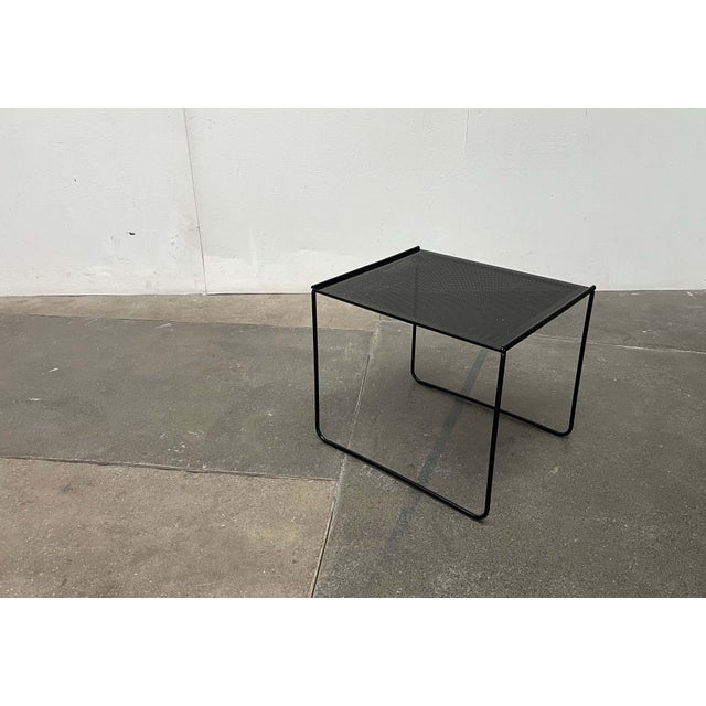 Postmodern metal side table from Ikea, dating from the 1980s. A delicate design. The finely crafted frame forms sled-like...
