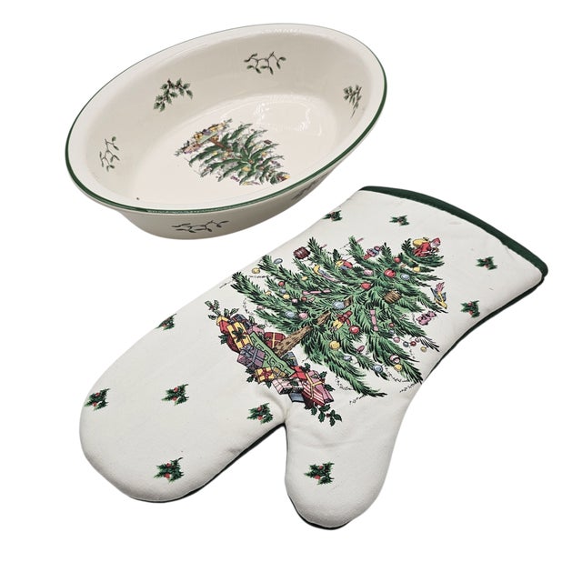 A ceramic dish, its rim kissed with holly sprigs, rests like a quiet invitation to the holiday table. At its heart, a...