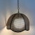 A lovely vintage scalloped-edge rattan/cane swag pendant light. Rattan/cane are woven together around a white glass globe...