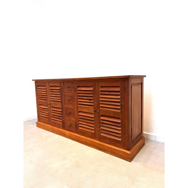 Crafted from beautiful teak wood, this elegant sideboard combines timeless craftsmanship with practical storage. The...