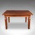This is an antique four seater dining table. An English, solid walnut kitchen table, dating to the Edwardian period, circa...