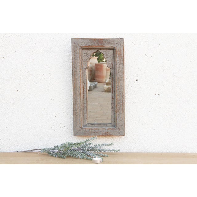 Bring the charm of old-world India into your home with this petite architectural mirror. Modeled after traditional...