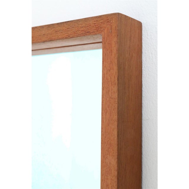 Minimalist Danish wall mirror. 1960s/1970s. High-quality craftsmanship. Solid teak frame. Pleasant, smooth, satin-matte...