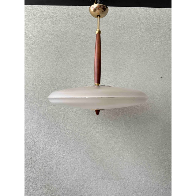 Elegant italian ceiling lamp model “baja” art. 5033, produced by lamiprogetti during the 1980s. The design pays clear...