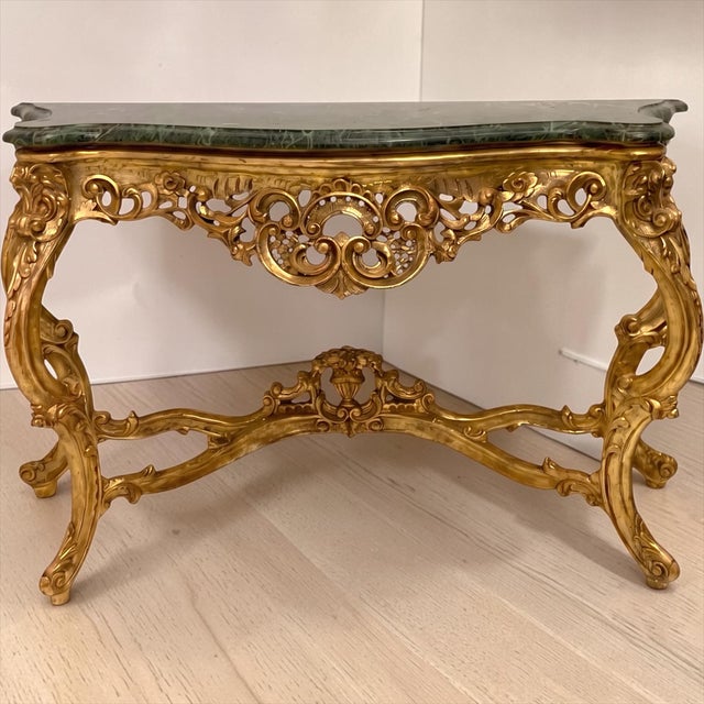 This is a lovely 1970s large scale Louis XV style console table with verde marble top. Its size makes it a dramatic...