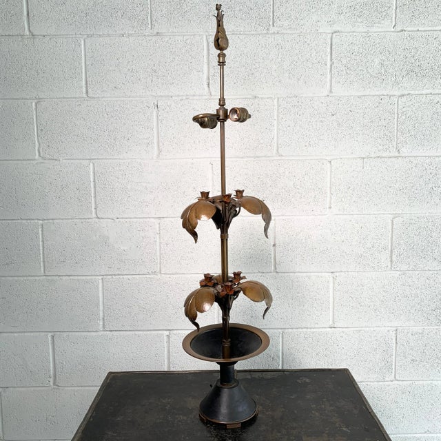 Elegant, brass, Arts & Crafts table lamp features a stem base with tiered leaves and planted rose buds with bud finial....