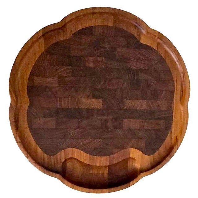 Offered is a Danish teak wood carving/charcuterie board designed by Richard Nissen. It features a subtly scalloped edge,...
