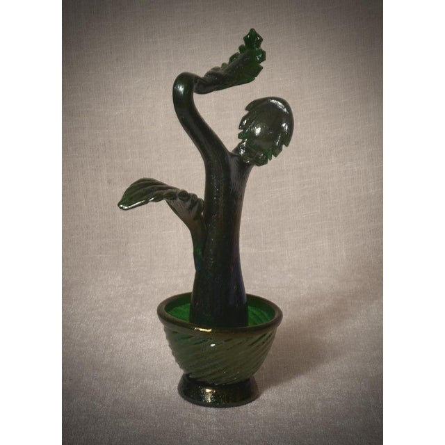 An Italian design, this cactus is an icon of Italian style, green in color and set within a beautiful green glass vase....