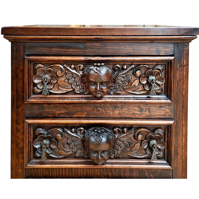 This piece is a magnificent Spanish Renaissance-influenced nightstand-commode, executed in the heavy, dramatic style that...