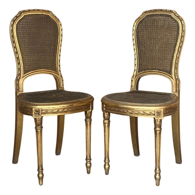 Pair of Early 20th Century French Louis XVI Style Gilted Dining Chairs with caned seats For Sale