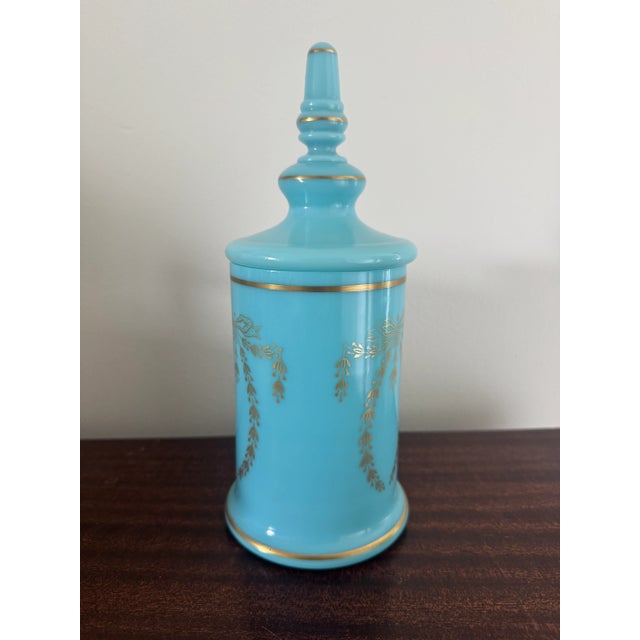 Listing is for a French turquoise blue opaline glass cologne bottle with laurel swag decoration by Portieux Vallerysthal....