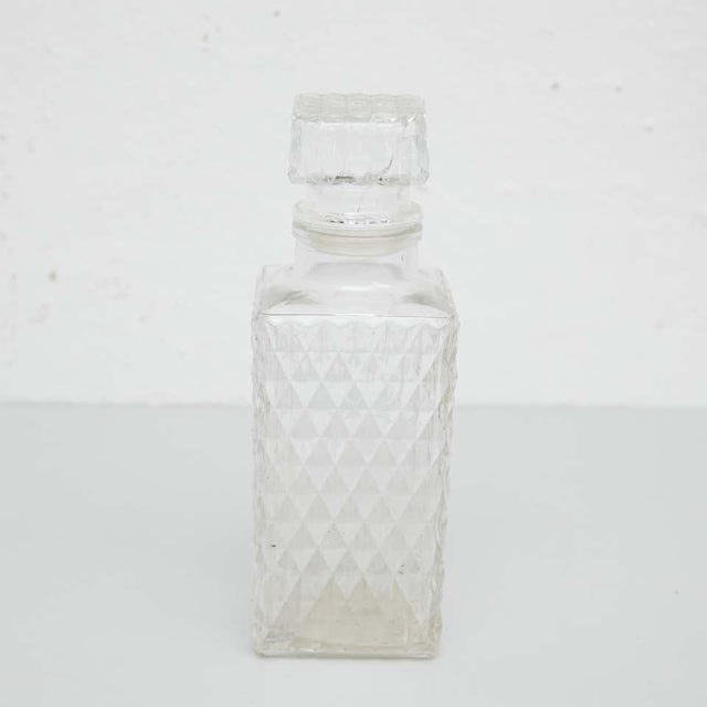 Set of glass whisky bottles and ice bucket with faceted block crystal design. By unknown manufacturer, spain, circa 1950....