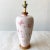 Incredible mid Century Modern table lamp. Features hand painted pink flowers over a light pink with a wooden base.
