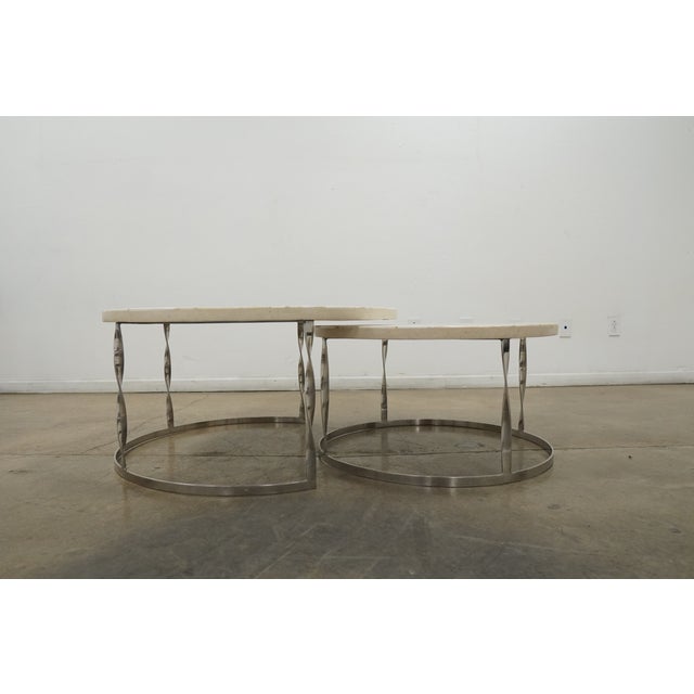 The Sirao Nesting Tables showcase fossilized giant clamstone shells sourced from the mountains of the Philippines—remnants...