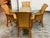 Design Plus Gallery presents a Vintage Rattan + Glass Dining Set from Bassett Furniture. The set includes a round glass-...