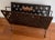 Great looking vintage pierced metal magazine rack. Dark rich grey-ish brown/Brovze patina with a wood handle. Nice size...