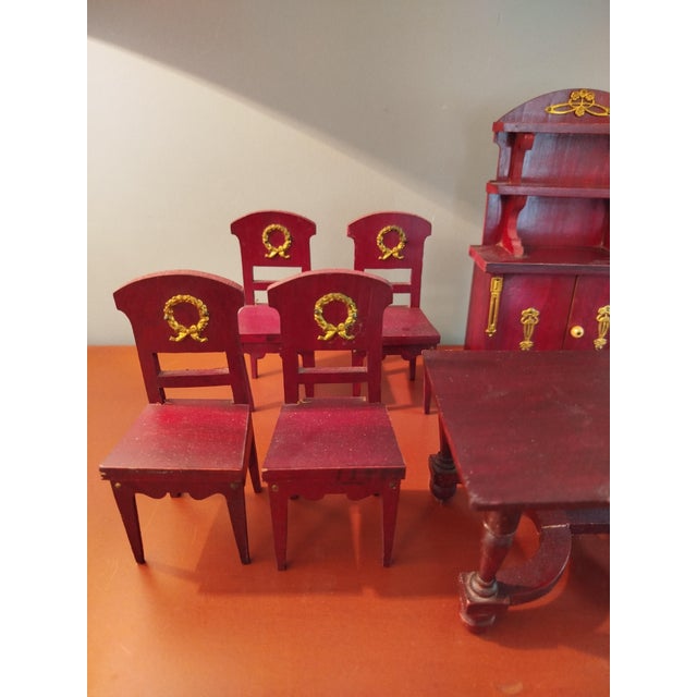 Antique toy furniture set for a dollhouse, 1:12 scale, made of mahogany-stained wood with gilt metal accents. Includes a...