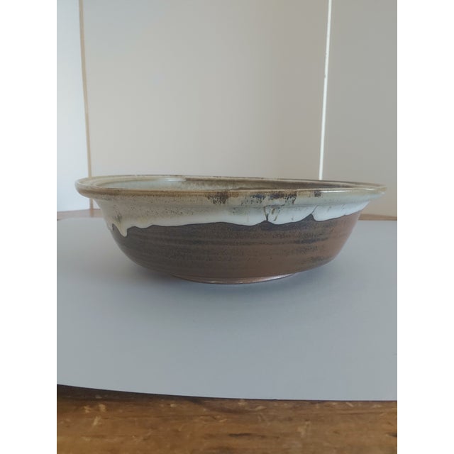 Offering a signed David Morris (1911-1999) studio pottery bowl. Mr. Morris is known as a pioneer in the pottery world...