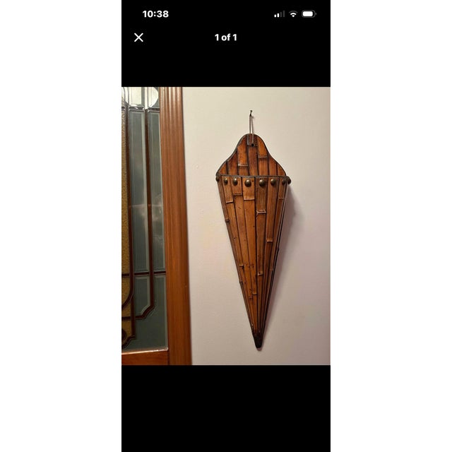 This bamboo, wall pocket planter, is embellished with 3/4” brass studs. It is very well made, and is not flimsy! The...