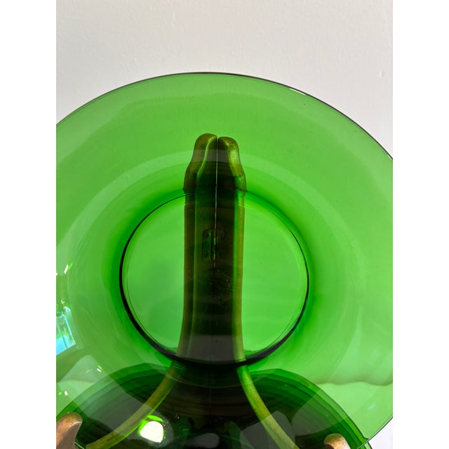 A set of 11 vintage emerald green glass bowls from Vereco, France. Each has a wide, softly sloped rim and a smooth center,...