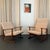 This exquisite pair of Scandinavian Modern lounge chairs were designed by Danish architect and furniture designer Ib...