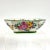 Delicately hand painted porcelain bowl with bright bouquet of flowers.