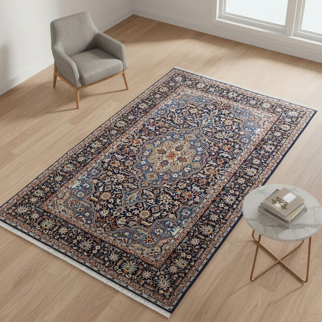 This stunning Vintage Persian Isfahan rug showcases an intricate floral medallion design, set against a rich navy blue...