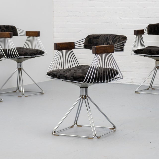 Set of four swivel ‘Delta’ dining chairs designed by Rudi Verelst for Novalux, Belgium, 1971. The design balances airy...