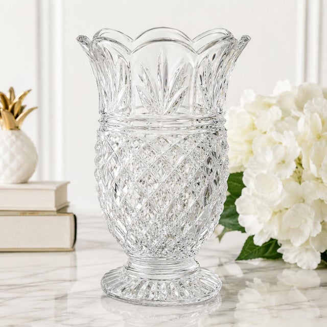Graceful and sculptural, this substantial vintage crystal-glass vase draws inspiration from the classic pineapple—a...