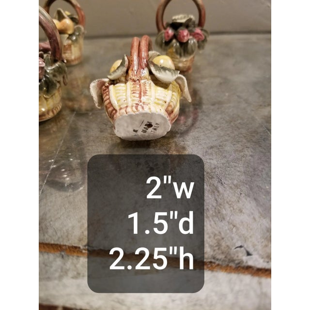 Vintage capodimonte ceramic place card Holders in the form of little baskets. There is a twelfth one that is included but...