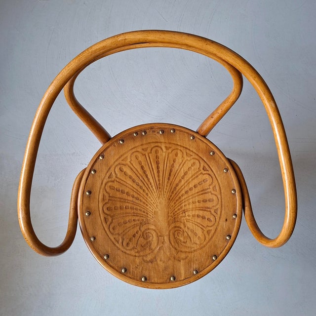 This bentwood beech honey-coloured chair was designed and produced around 1900 by jacob & josef kohn* and later also by...