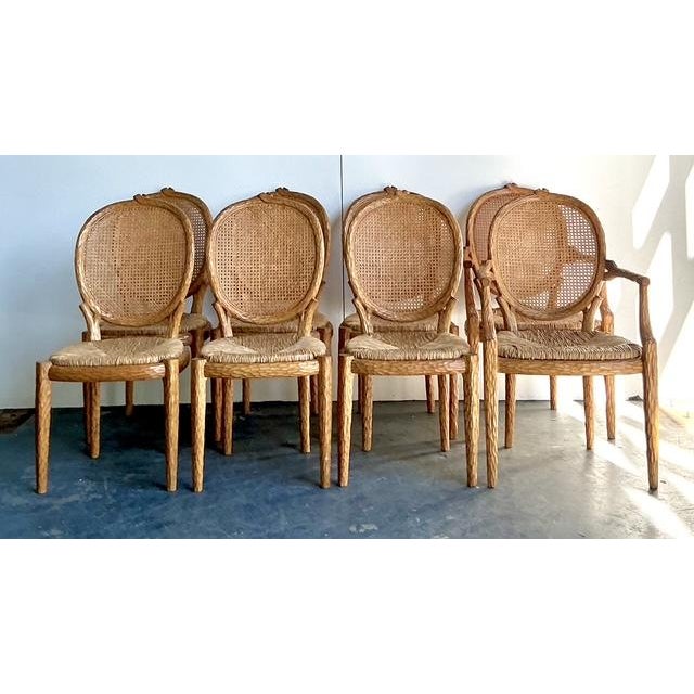 This remarkable set of eight dining chairs by the prestigious house of Lorin Marsh is a masterful celebration of Hollywood...