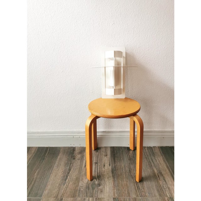 The saturn wall lamp is a classic by the danish lighting manufacturer louis poulsen based on a design by joachim lepper....