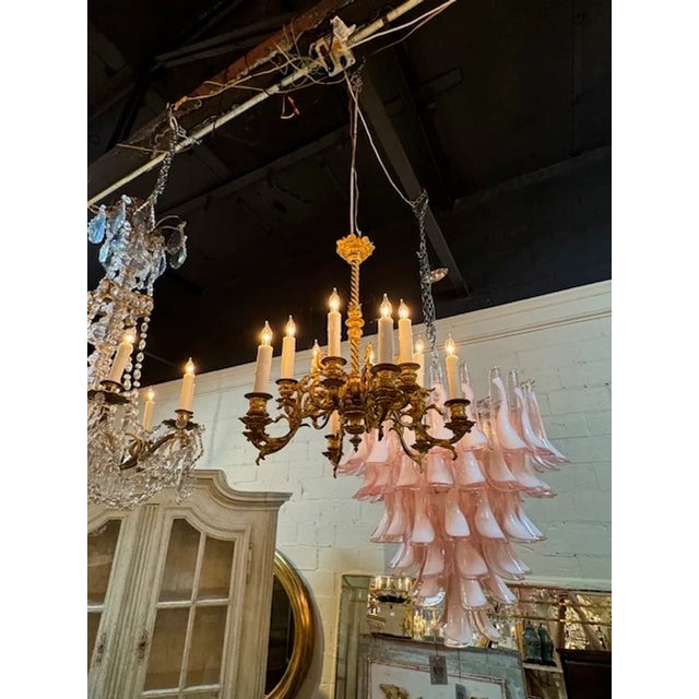 Handsome French bronze chandelier with 12 lights. Creates and elegant look! Circa 1890. This fixture is wired and comes...