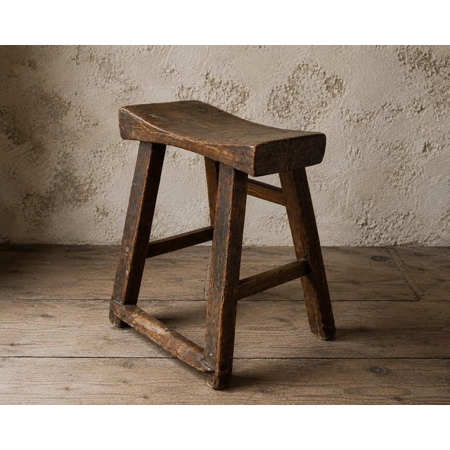 An exceptional 17th century English primitive elm milking stool, handcrafted using traditional pegged mortise-and-tenon...