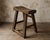 An exceptional 17th century English primitive elm milking stool, handcrafted using traditional pegged mortise-and-tenon...
