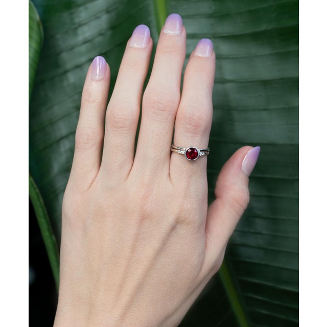 A sleek open band ring accented with sparkling natural Diamond details for a modern yet timeless look. Crafted in solid...