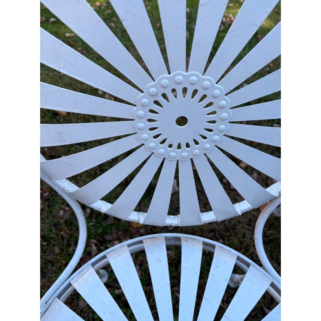 This listing is for an authentic pair of vintage François Carré style "Sunburst" (or Pinwheel) spring steel garden...