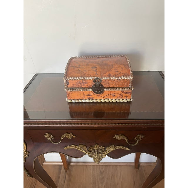 Beautiful treasure box with antique conquistadores map of the world collage, elegantly trimmed with a border of sea shells.