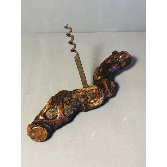 2 corkscrews, one of them made of root with engraving on the metal by Bernard Siret French, the other without marks made...