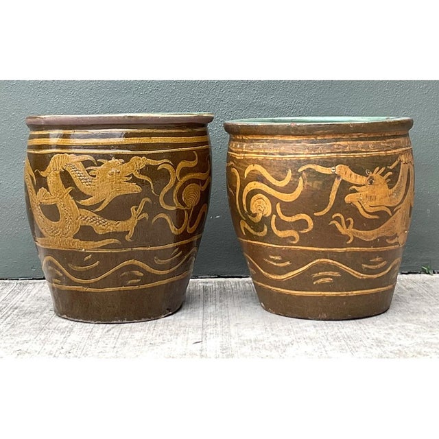 Showcasing a masterful application of traditional Chinese ceramic artistry, this exceptional pair of vintage planters...